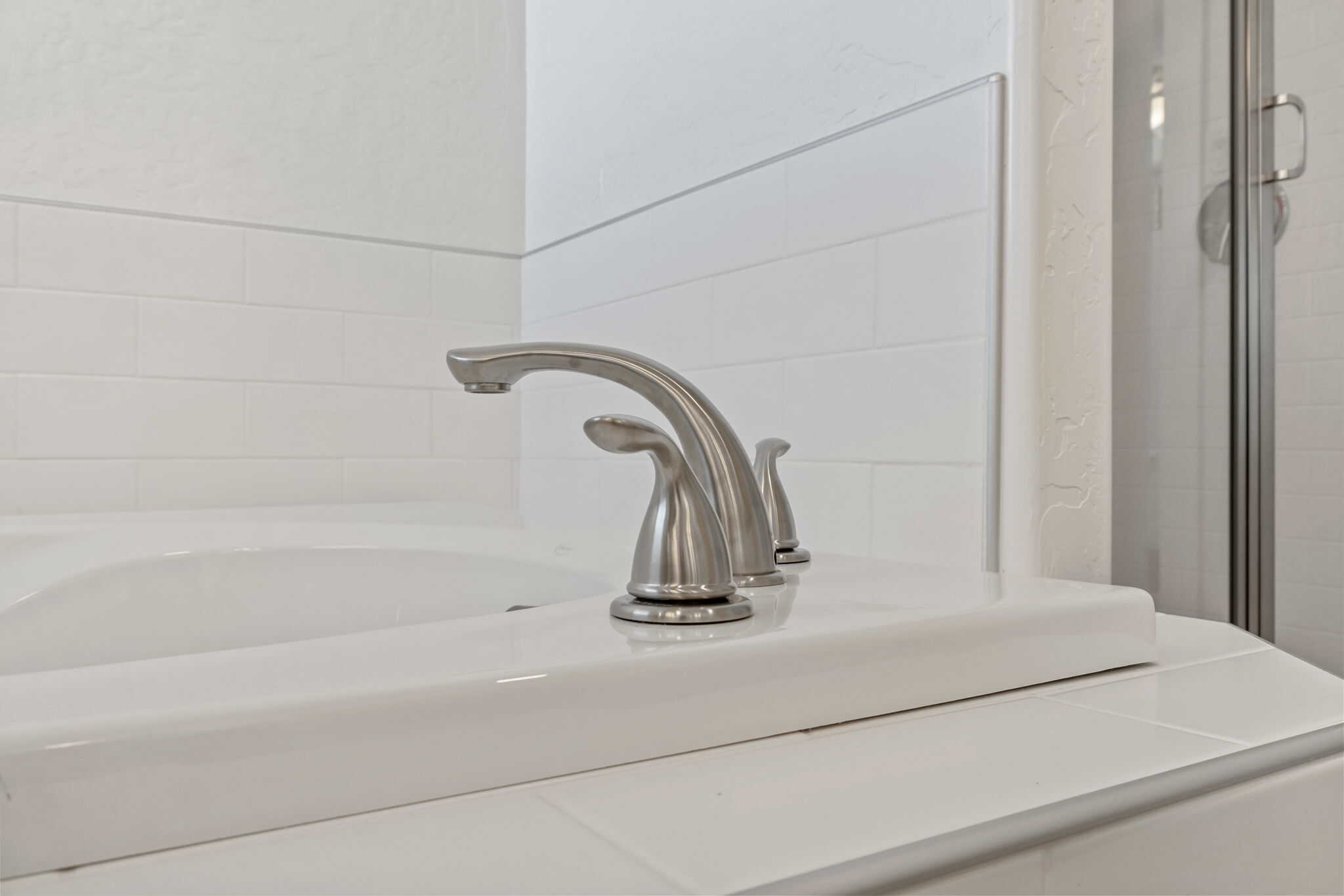 Bathroom sink faucet and countertop for modern bathroom design.